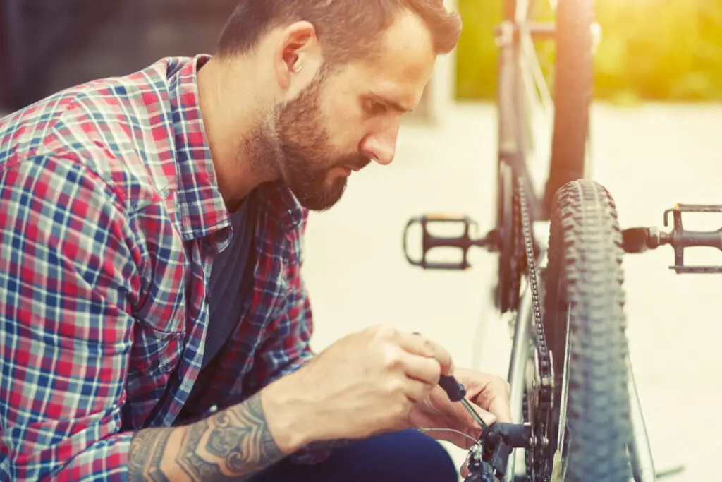 man fixing bike